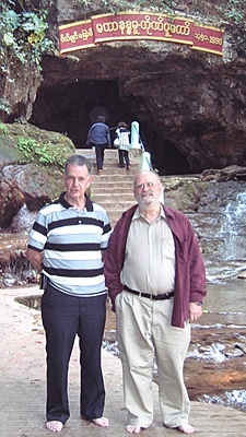 Tom Garrett (left) and Father John Behnke, CSP, stand in front of a Buddhist cave in Mandalay, Myanmar (Burma).