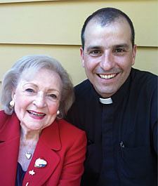 The legendary Betty White poses with Paulist Productions President Father Eric Andrews on the set of The Lost Valentine.