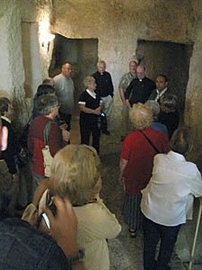 The pilgrims gather at the Church of St. Peter in Gallicantu, where Jesus was imprisoned overnight in the house of Caiaphus, the high preist. It was here that Peter denied Jesus three times.