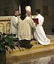 Auxiliary Bishop Francisco Gonzalez Valer, SF, of the Archdiocese of Washington, D.C., accepts the promise of obedience of Dat Q. Tran, CSP, as Mr. Tran is ordained a transitional deacon.
