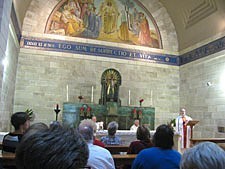 Father Larry Rice, CSP, gives the homily during Mass at the Church of Mary, Martha and Lazarus in Bethany.