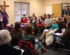 Father Don Andrie, CSP, and the faith community of St. Luke University Parish in Allendale, Mich., gather at the pairsh offices to celebrate Mass on Ash Wednesday, 2010.