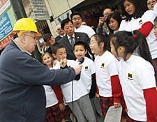 Father Daniel McCotter, CSP, interviews students at the groundbreaking of the new St. Mary’s Chinese School in San Francisco.