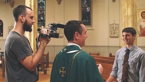 Busted Halo Production Editor Joe Williams directs a scene with Father Dave Dwyer, CSP, for the popular Sacraments 101 videos. 