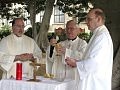 Father Larry Rice, CSP (left), Father Paul G. Robichaud, CSP, and Father Wayne Ball celebrate an outdoor Mass with the piilgrims at the Mount of the Beatitudes.