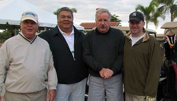 National Chairman Bob Schweitzer from Horseshoe Bay, Tex., (left)  Father Ruben Patino, pastor of St. Paul the Apostle Chapel in Horseshoe Bay; Tom Gibbons Sr. from New Jersey and Deacon Tom Gibbons Jr., prepare for the beginning of play at the Grand Harbor Golf Course in Vero Beach, Fla.