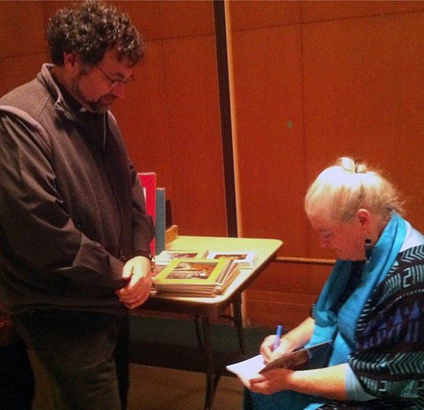 Father Frank Desiderio, CSP, director of the Paulist Center in Boston, gets a book autographed by Dr. Megan McKenna.