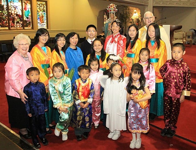 Mary's court – children at St. Mary's School – gathers with St. Mary's Principal Nancy Fiebelkorn (far left) and Father Daniel McCotter, CSP, pastor of Old St. Mary's Cathedral, Holy Family Chinese Mission and St. Mary's School and Chinese Center in San Francisco.
