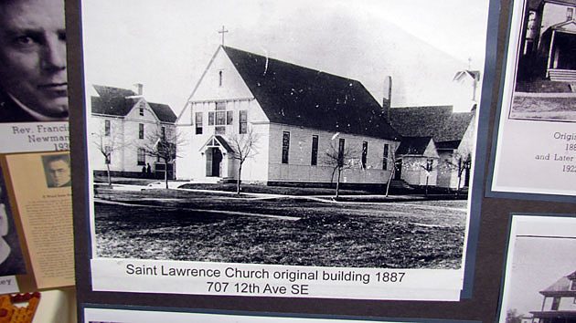A photo collage honoring the 125 years of faith at St. Lawrence Church and Newman Center in Minneapolis. The main photo shows the original 1887 white clapboard church building.