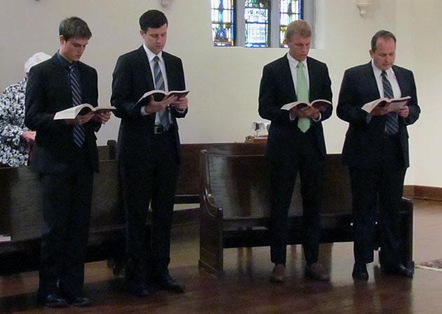 Evan Cummings (left) , Paulo Puccini, Michael Cruickshank and Daniel Arthur sing the entrance hymn during the Mass where they will officially sign in as Paulist novices Aug. 24 at St. Paul's College in Washington, D.C.