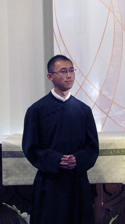 Jimmy Hsu, CSP, prepares to make his final promise with the Paulist Fathers during a Sept. 6 Mass in the chapel of St. Paul's College in Washington, D.C.
