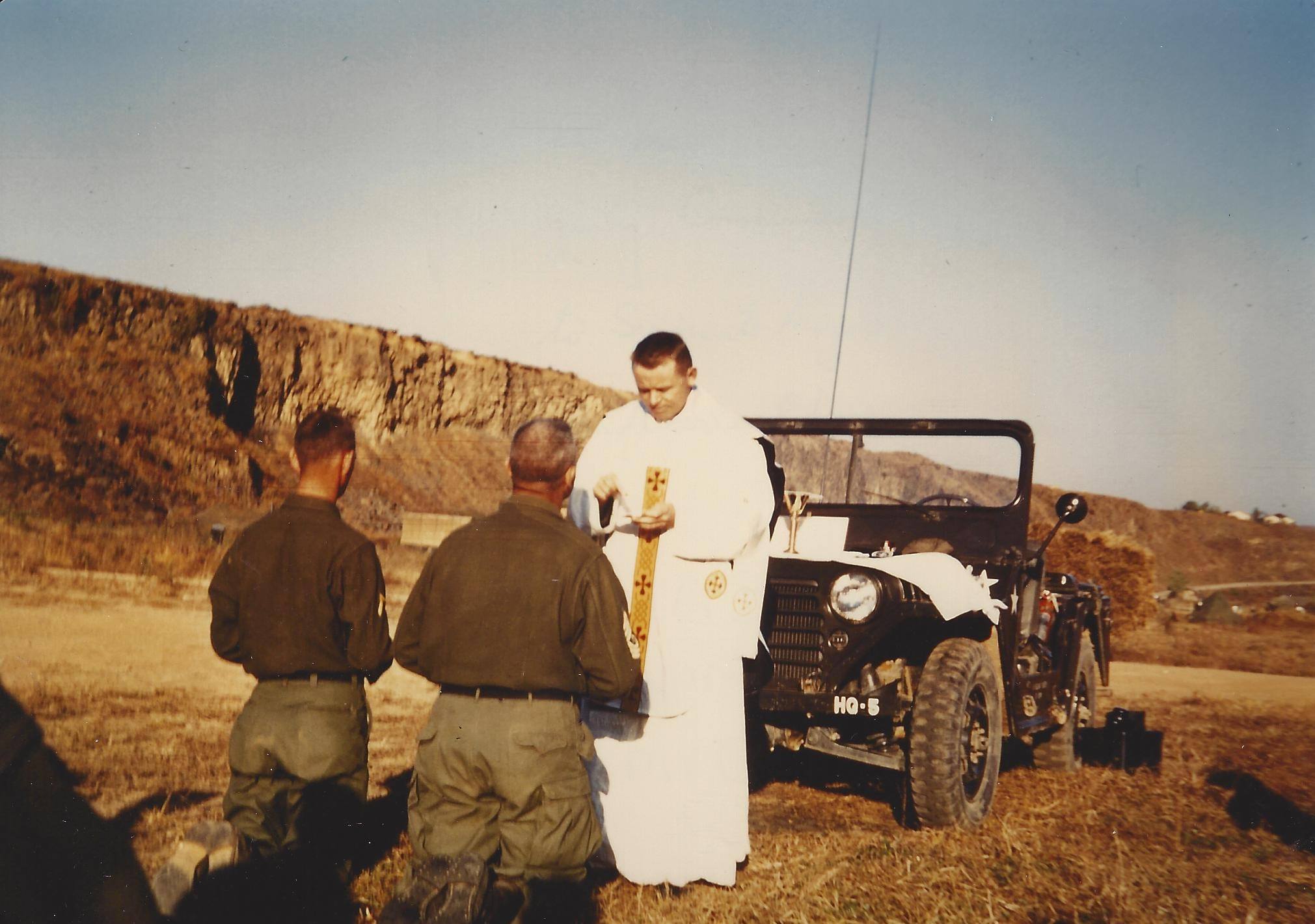Paulist Fr. Kevin Devine speaking at the end of a Mass in Korea during his service as a U.S. Army chaplain.