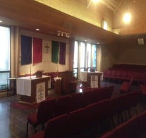 Sanctuary view of the two altars and ambo.