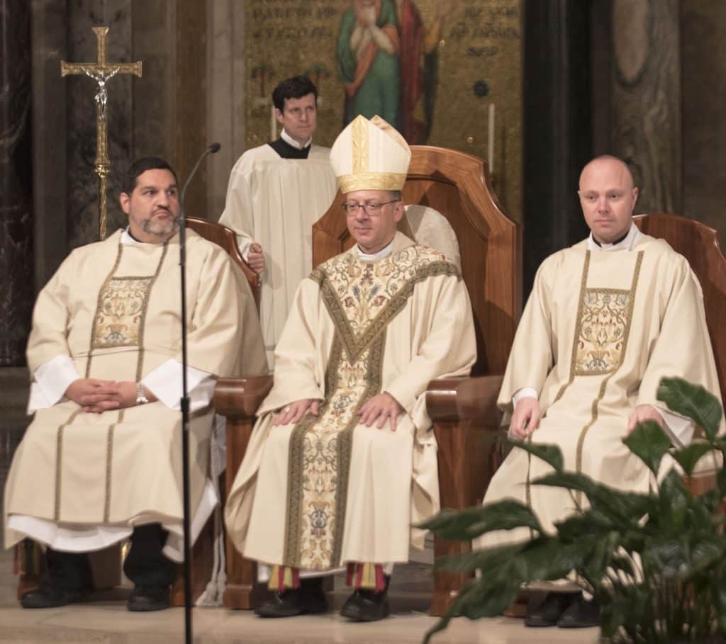Bishop Barry Knestout, center, with Paulist Deacon Ryan Casey (left) and Deacon Michael Hennessy (right) shortly after he had ordained the pair transitional deacons on Saturday, September 2, during a Mass in the Crypt Church of the Basilica of the National Shrine of the Immaculate Conception in Washington, D.C.