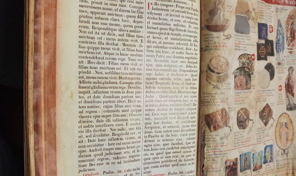 Figure 6: A close-up of the Missale Romanum, Page 94 after it was glued from the spine to the edge of the holiday catalog prior to aging