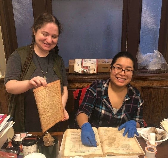 Figure 7: Michelle Levy (standing) and Christina Orozco (seated) are the Assistant Archivists of the Paulist Fathers and are based in New York City.