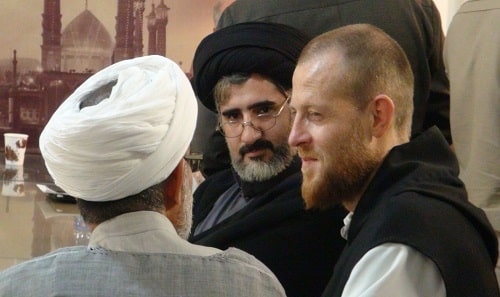 A French Trappist monk in dialogue with two Shi‘a Muslims at a Monastic-Muslim dialogue in Qom, Iran